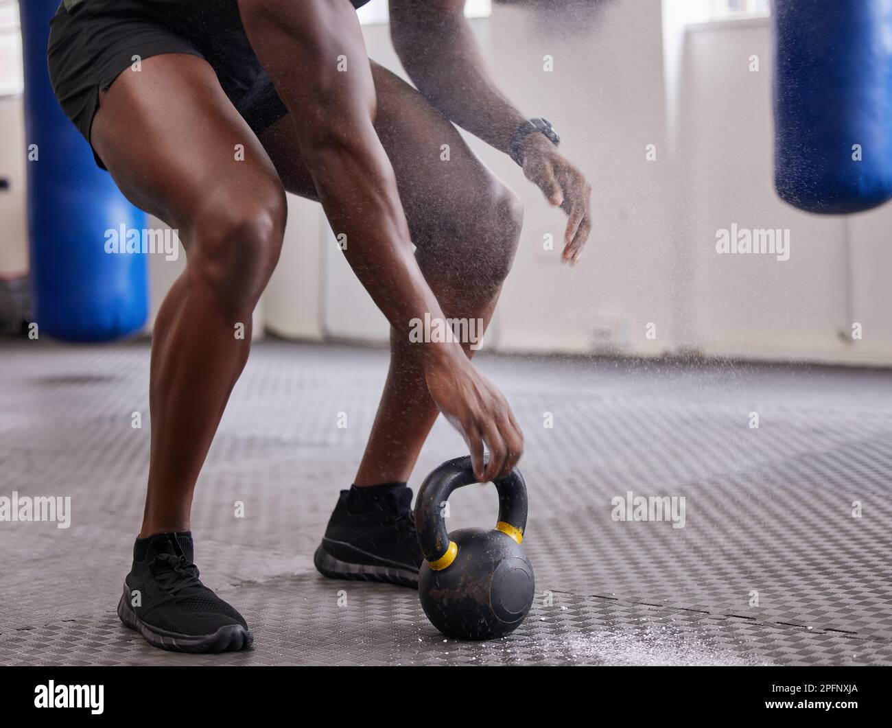 Kettlebell, hands and legs of man training for weightlifting, fitness