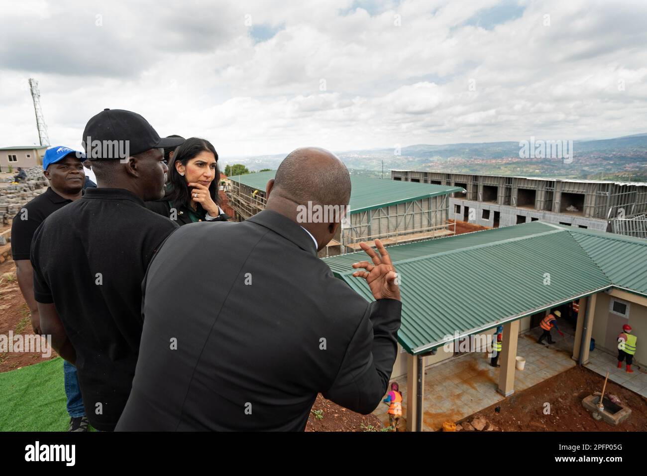 Home Secretary Suella Braverman tours a building site on the outskirts of Kigali during her visit to Rwanda, to see houses that are being constructed that could eventually house deported migrants from the UK. Picture date: Saturday March 18, 2023. Stock Photo