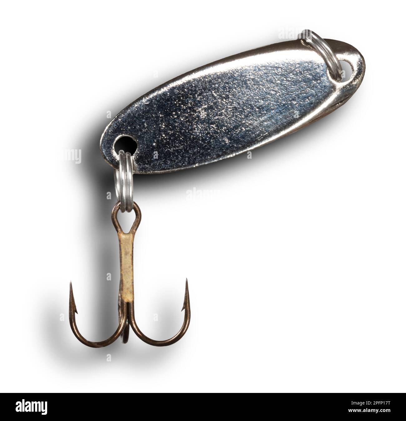 Shadow behind a shiny spoon for fishing with treble hook below the lure