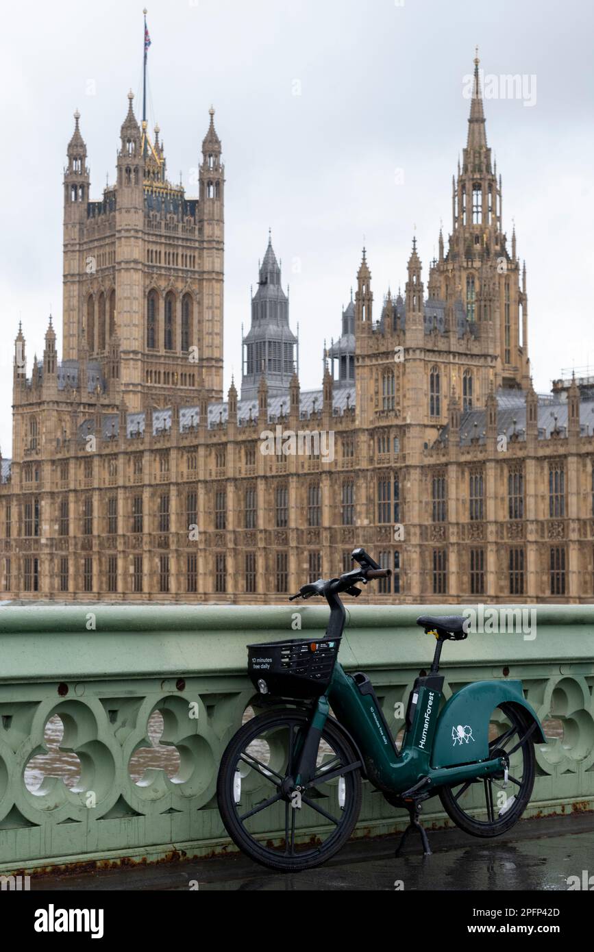 Westminster, London, UK. 18th Mar, 2023. The day has begun wet and overcast. A number of hire scheme e-bikes have been left by London landmarks. Westminster Bridge Stock Photo