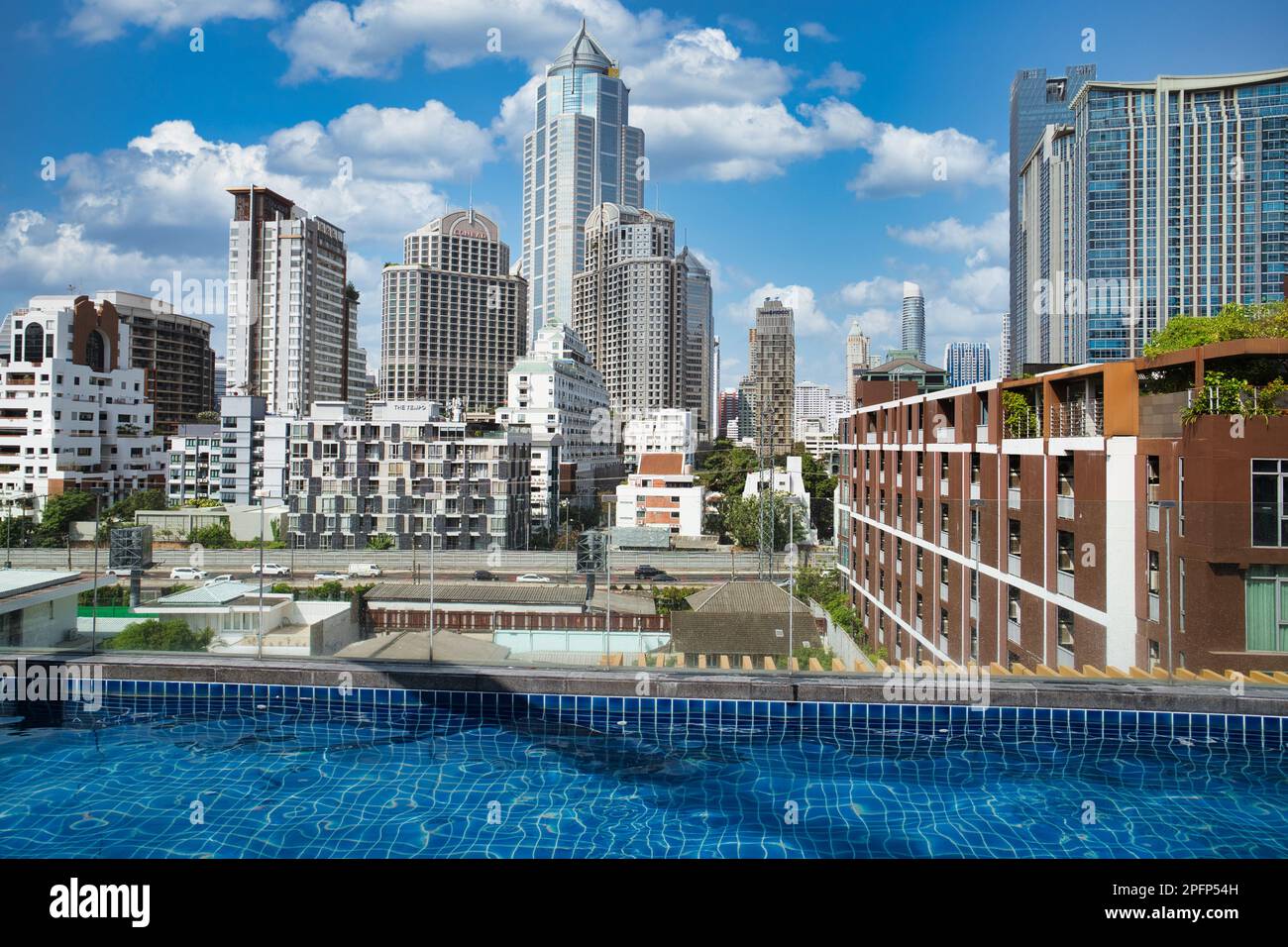 The Bangkok skyline seen from the rooftop swimming pool at the Hotel Icon, Sukhumvit, Bangkok