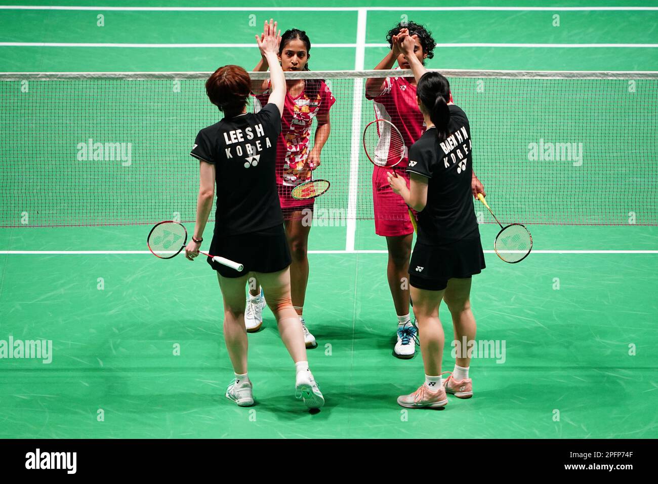 India's Treesa Jolly (top right) and Gayatri Gopichand Pullela (top left) in action against Korea's Baek Ha Na (bottom right) and Lee So Hee during day four of the YONEX All England Open Badminton Championships at the Utilita Arena Birmingham. Picture date: Friday March 17, 2023. Stock Photo