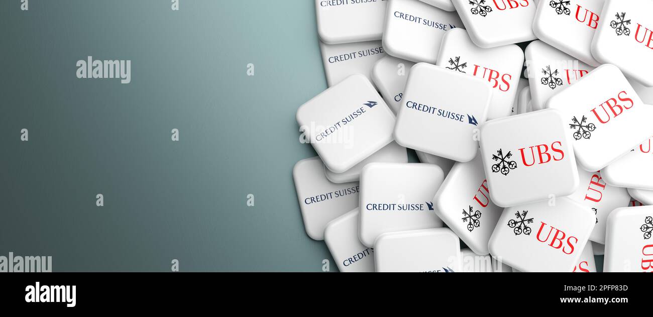 Logos of Credit Suisse and UBS Bank on a heap on a table. Concept for a possible merger or take over. Copy space. Web banner format. Stock Photo