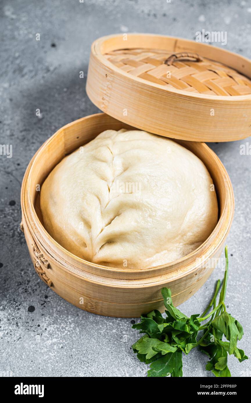 Pyanse steamed bun in a Bamboo steamer, korean street food. Gray