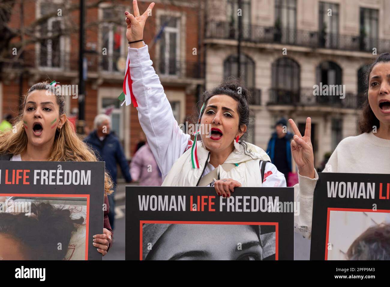 London, UK. 18th Mar, 2023. Woman Life Freedom, Iran protest at an international day of action against racism event is taking place in London, with protesters gathering outside the BBC in Portland Place. Subjects being protested against include the UK Government’s Rwanda plan, the Nationality and Borders Act, and alleged racist deportations and the hostile environment. Stock Photo