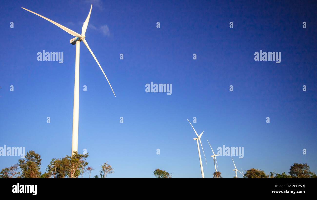 A wind turbine is a wind turbine that takes the kinetic energy from the movement of the wind and converts it into mechanical energy. Then use mechanic Stock Photo