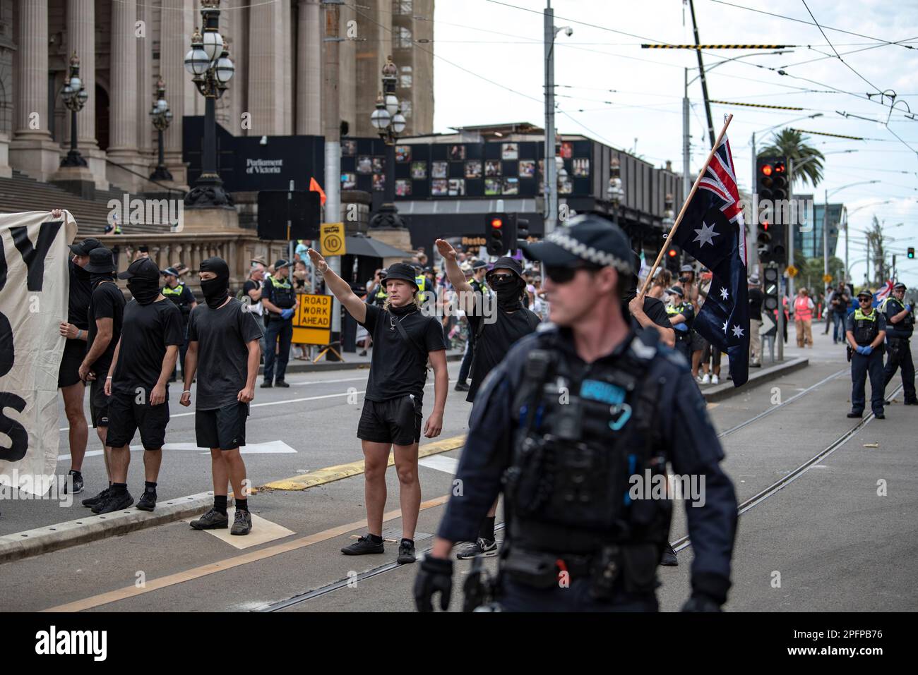 Melbourne, Australia, March 18th 2023. With no interference from police, neo-nazis freely salute at counter-protesters at a Trans Exclusionary Radical Feminist (TERF) rally, where feminists discredit non-conforming gender identities, specifically transgender women. Credit: Jay Kogler/Alamy Live News Stock Photo