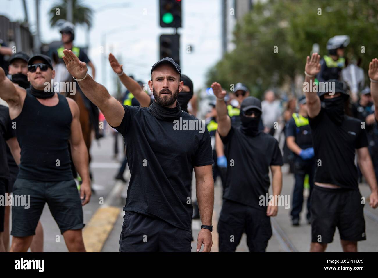 Melbourne, Australia, March 18th 2023. Thomas Sewell and fellow neo-nazis saluting at counter-protesters at a Trans Exclusionary Radical Feminist (TERF) rally, where feminists discredit diverse gender identities, specifically transgender women. Credit: Jay Kogler/Alamy Live News Stock Photo