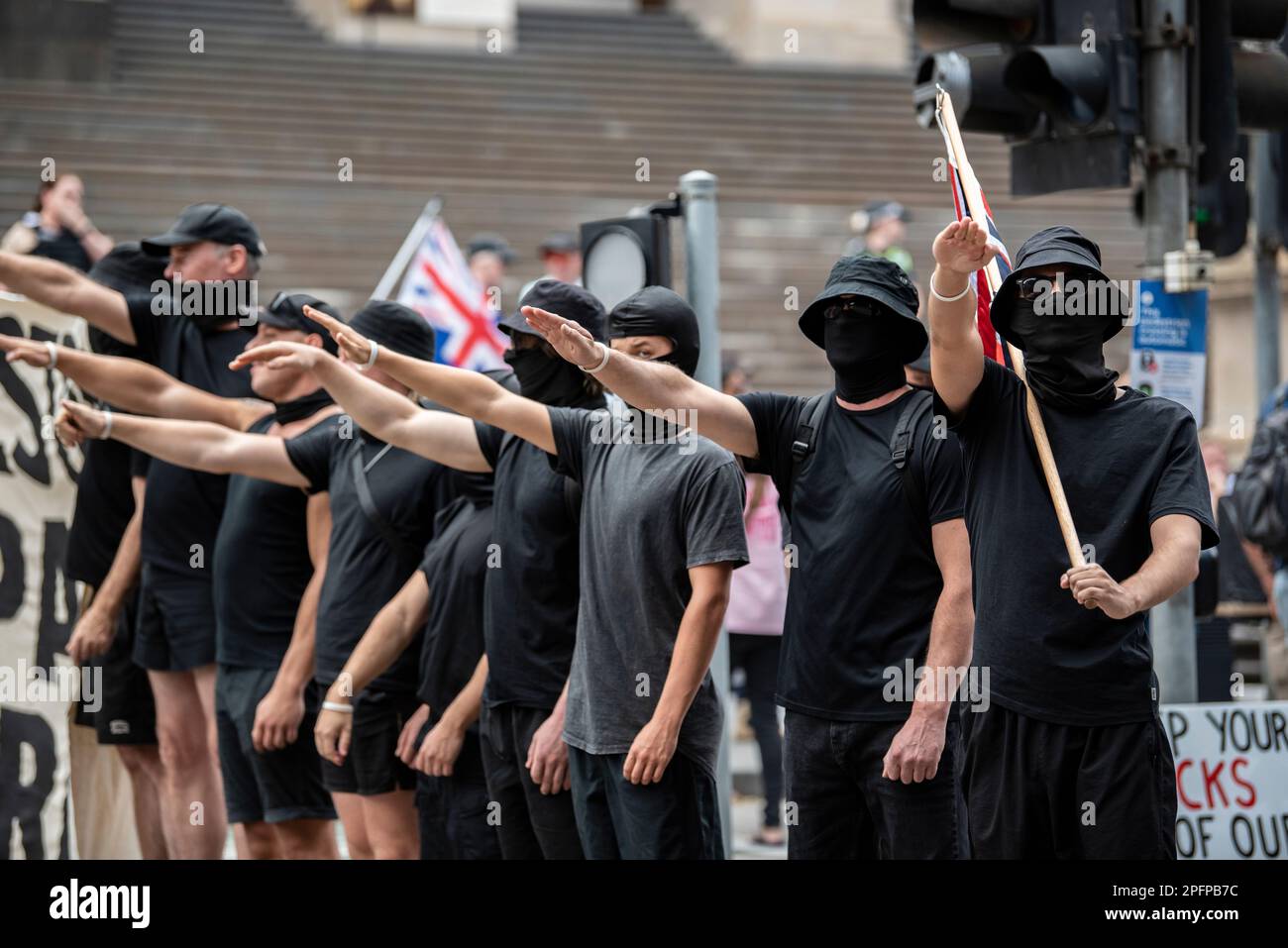 Melbourne, Australia, March 18th 2023. Neo-nazis saluting at counter-protesters at a Trans Exclusionary Radical Feminist (TERF) rally, where feminists discredit diverse gender identities, specifically transgender women. Credit: Jay Kogler/Alamy Live News Stock Photo