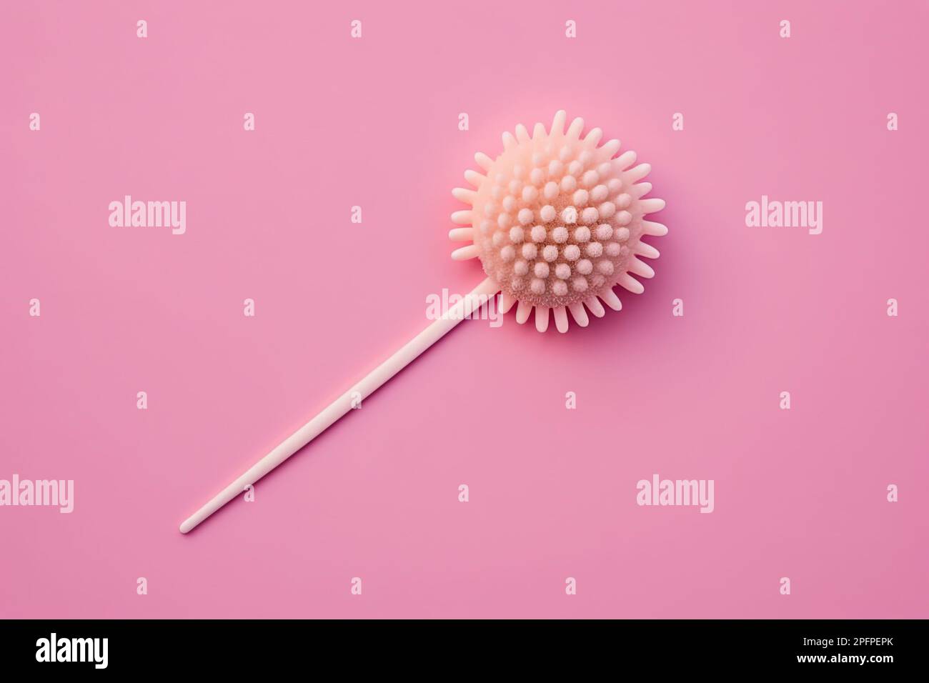 A Reusable silicone swab on pink background. Alternative to cotton buds