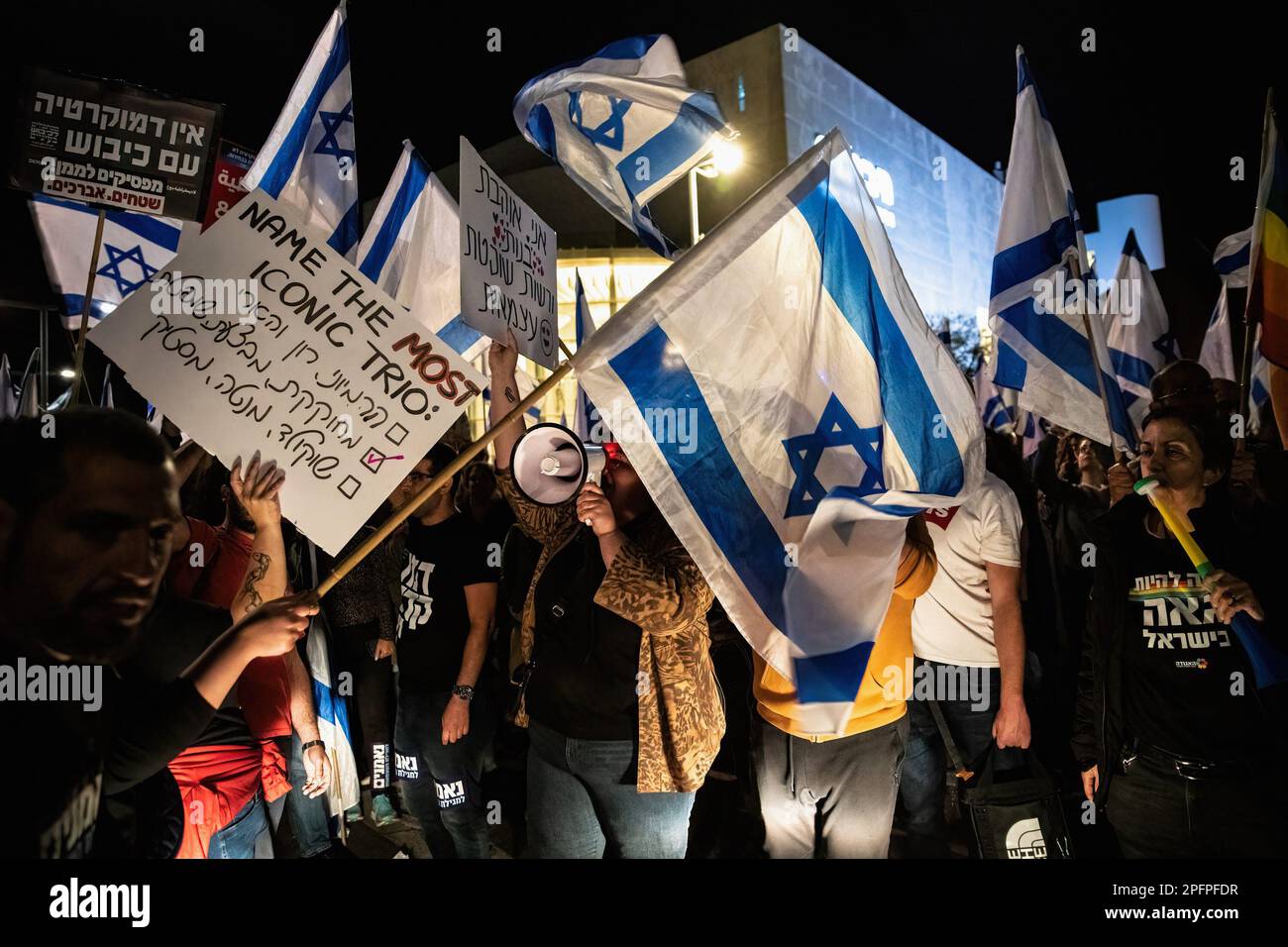 Tel Aviv, Israel. 16th Mar, 2023. Protesters hold placards and Israeli flags during the demonstration. Israeli protesters against the legal overhaul rallied around the country to disturb the public order for the third time. Credit: SOPA Images Limited/Alamy Live News Stock Photo