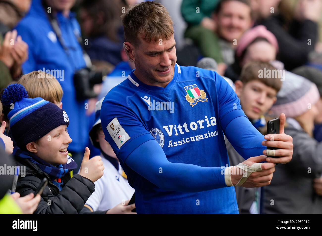 Federico Ruzza 5 of Italy poses for a selfie with a young fan after