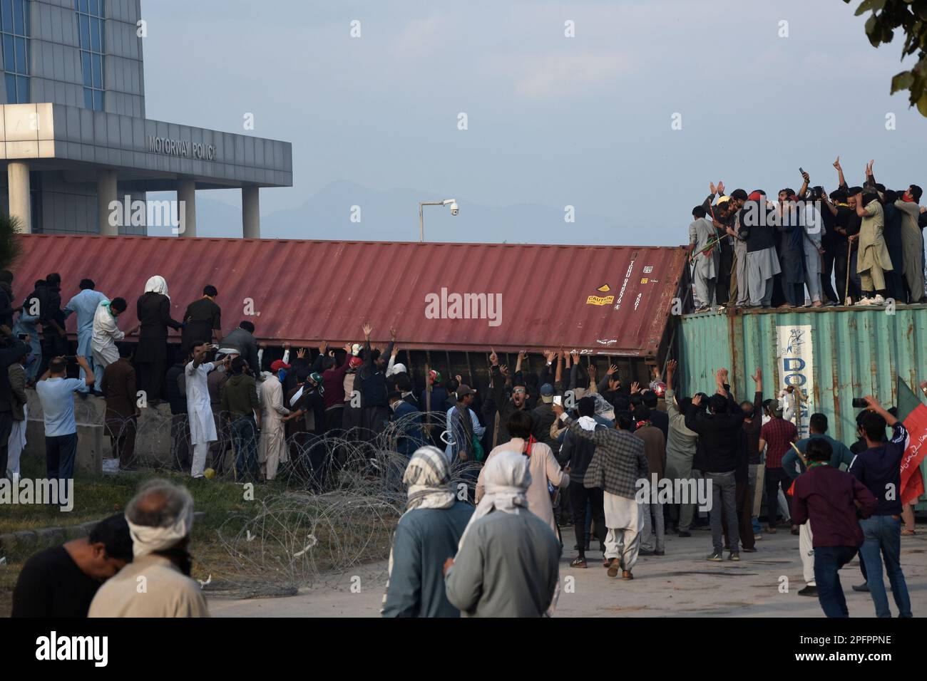 Supporters Of Former Prime Minister Imran Khan Remove A Shipping ...