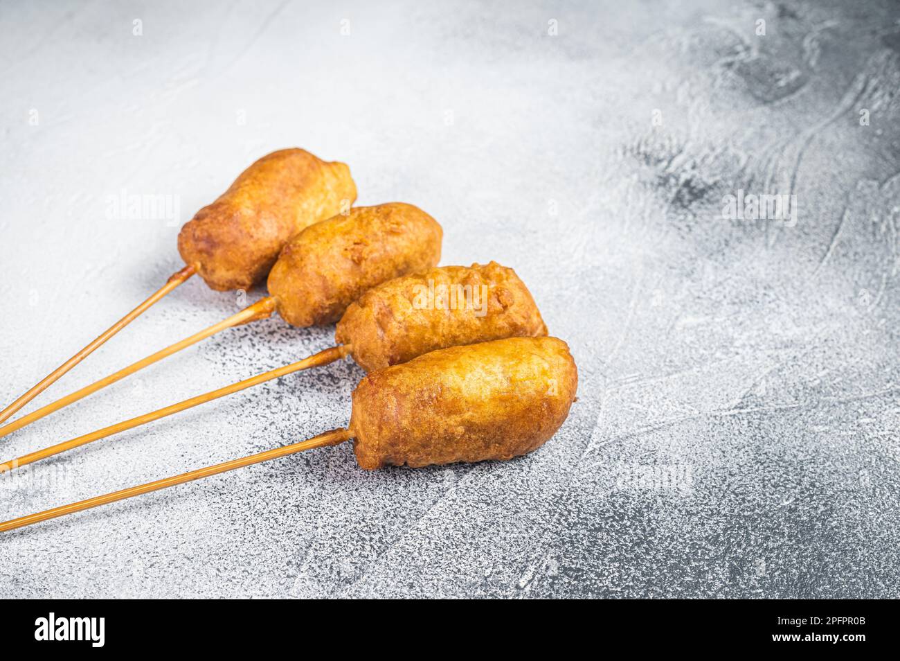 Homemade deep fried corn dogs. White background. Top view. Copy space