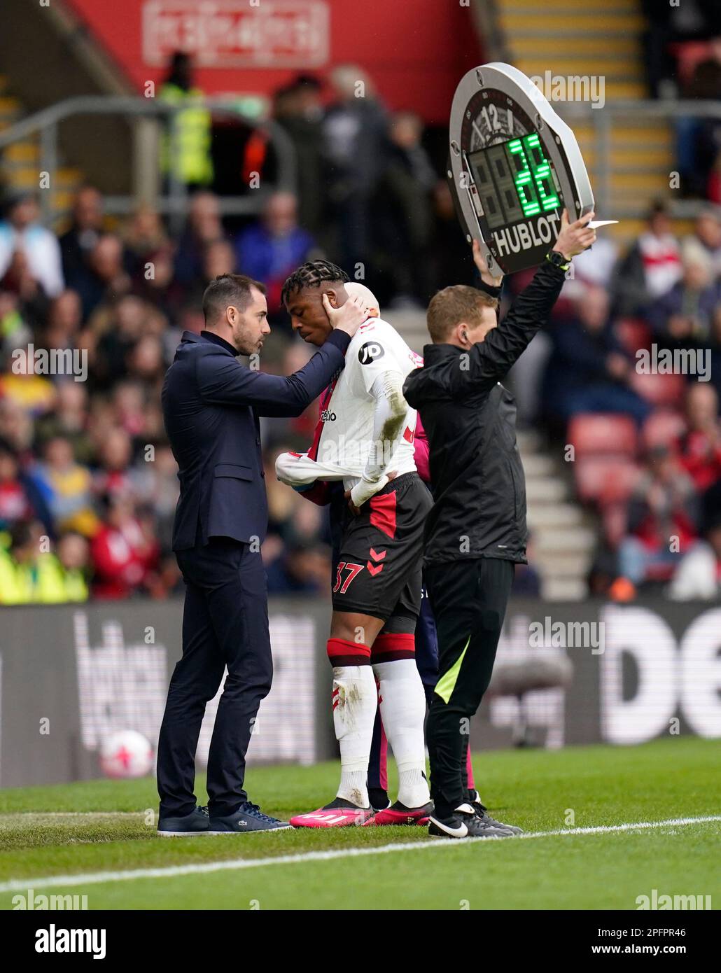 Southampton's Armel Bella-Kotchap leaves the field of play after picking up an injury during the Premier League match at St Mary's Stadium, Southampton. Picture date: Saturday March 18, 2023. Stock Photo