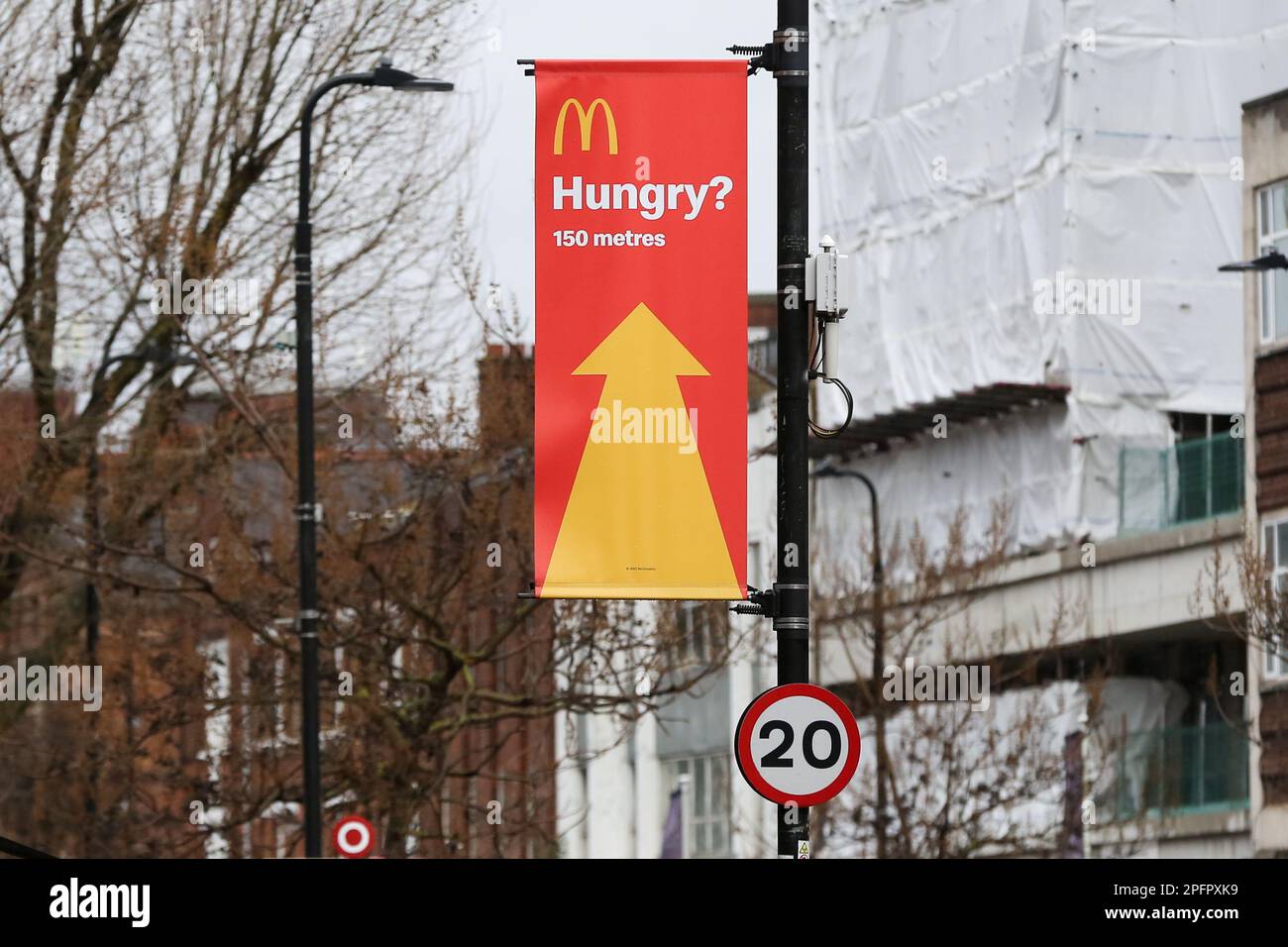 A McDonald's banner showing the direction to the fastfood chain