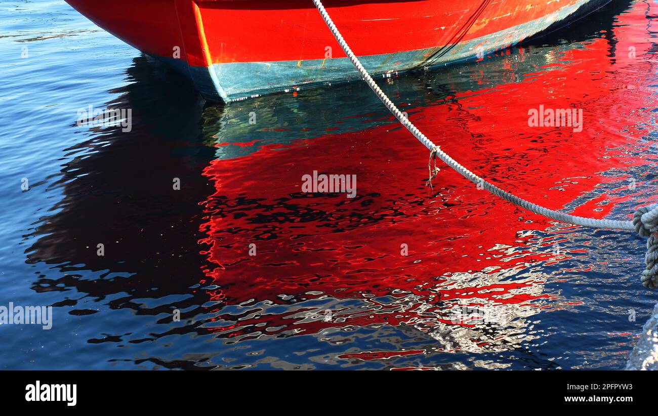 boatreflection on harbor Stock Photo