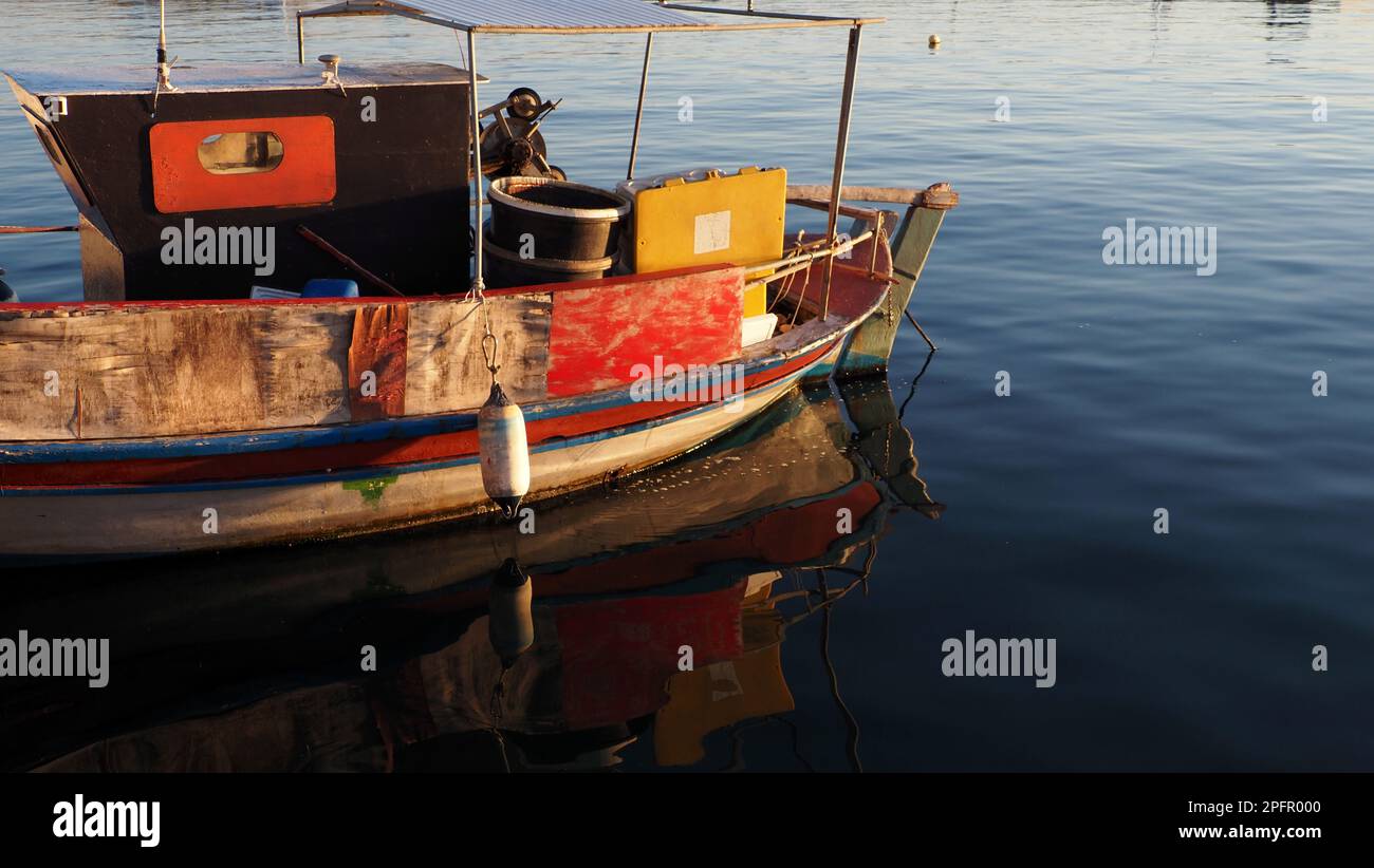 boatreflection on harbor Stock Photo