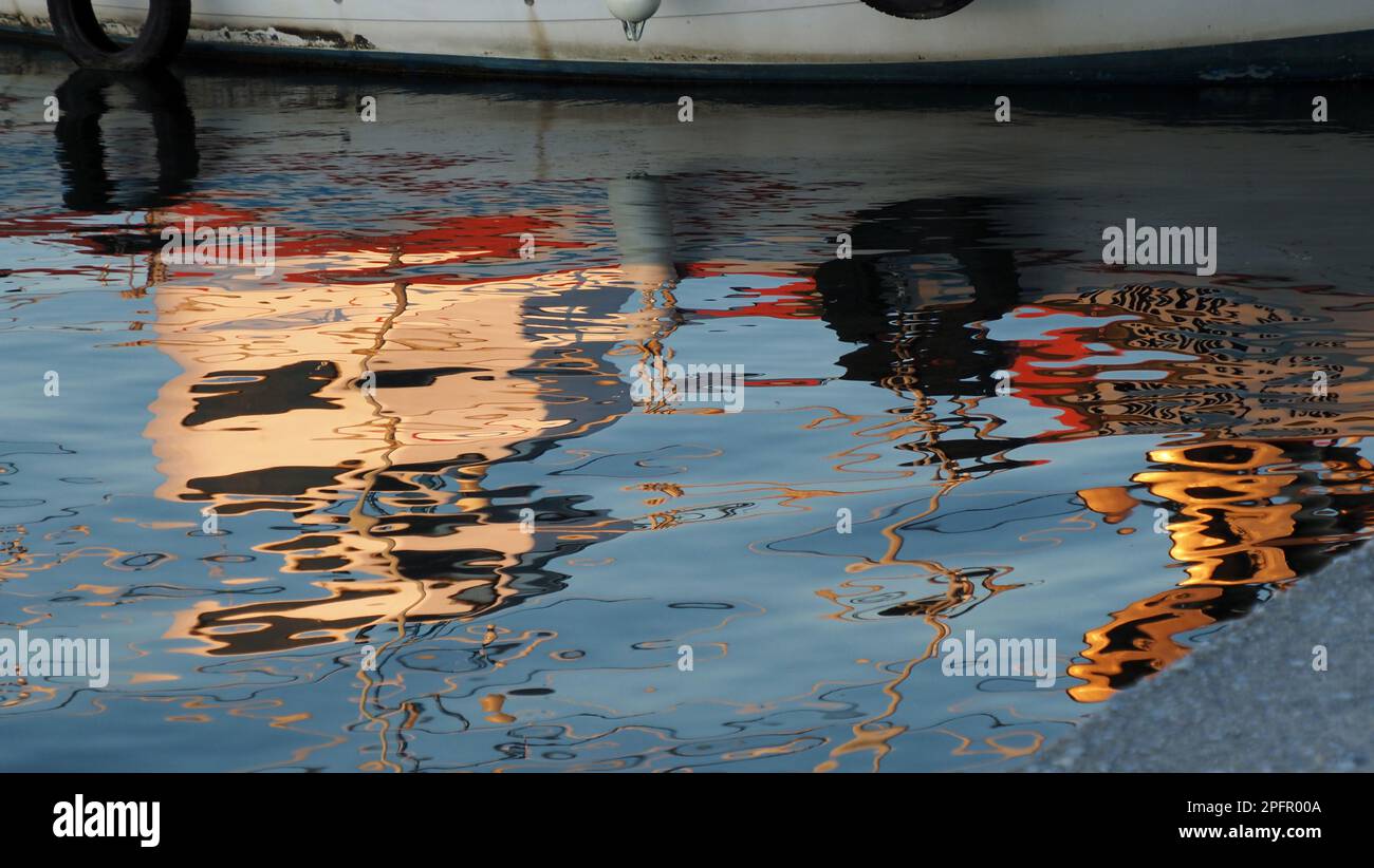 boatreflection on harbor Stock Photo