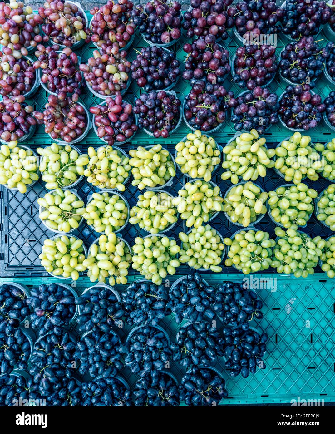 Tubs of red, white and black grapes sold on the streets of Cape Town Stock Photo