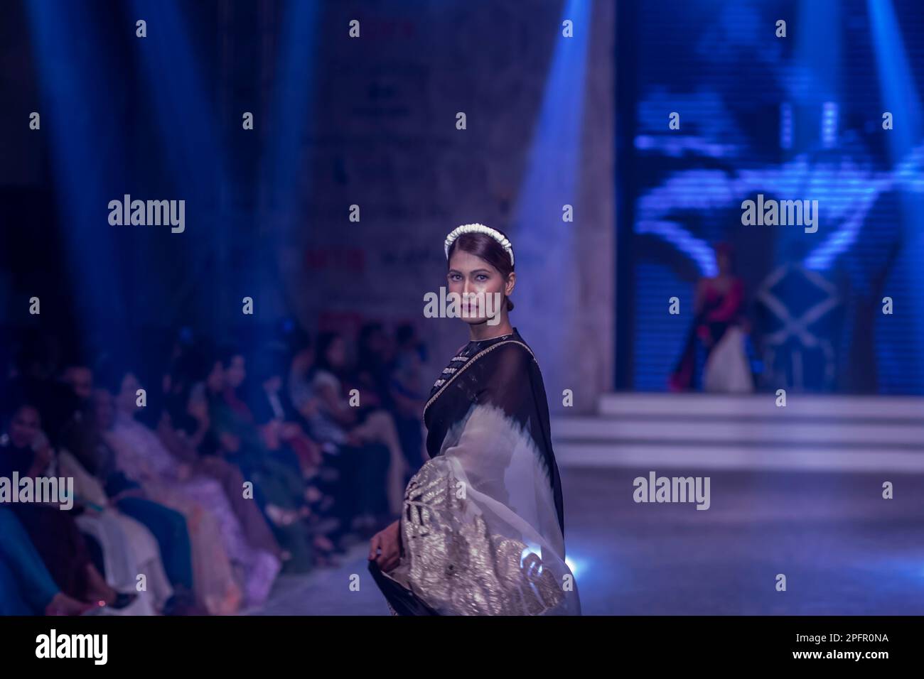 Dhaka, Bangladesh. 17th Mar, 2023. A model walks the runway at the