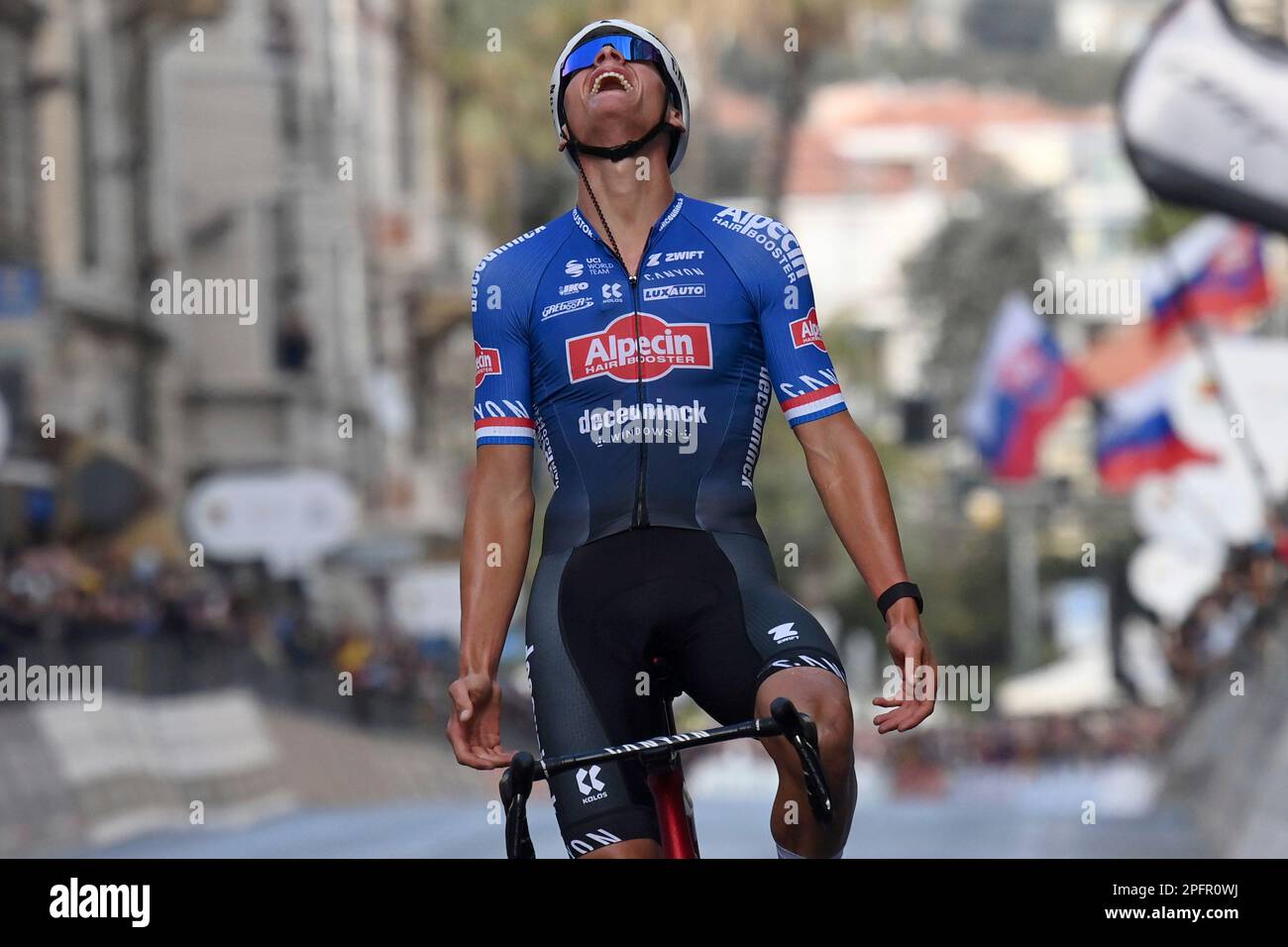 Netherlands Mathieu Van der Poel celebrates as he crosses the finish line to win the Milan to Sanremo cycling race, Italy, Saturday March 18, 2023