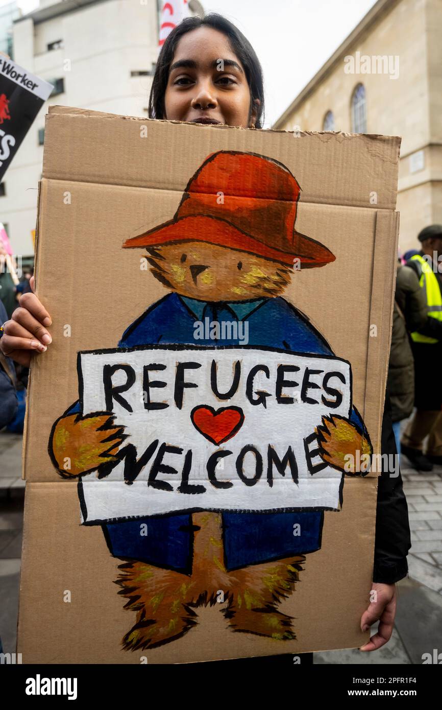 London, UK. 18 March 2023. A woman with a sign takes part in a 'Resist ...