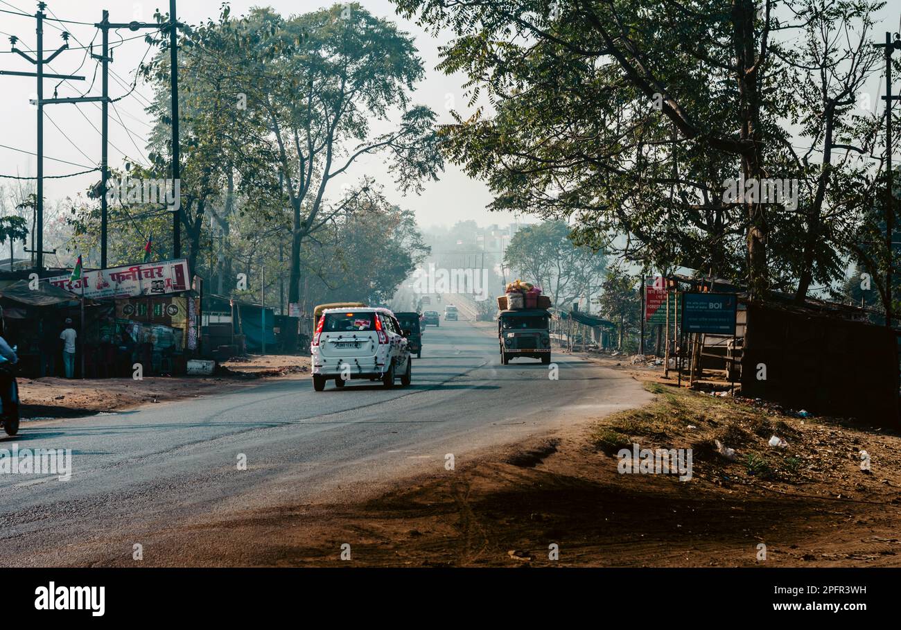 Cars on a City road on a misty foggy morning. Focus on Foreground. Naisarai Ramgarh Jharkhand India South Asia Pacific February 28, 2023 Stock Photo