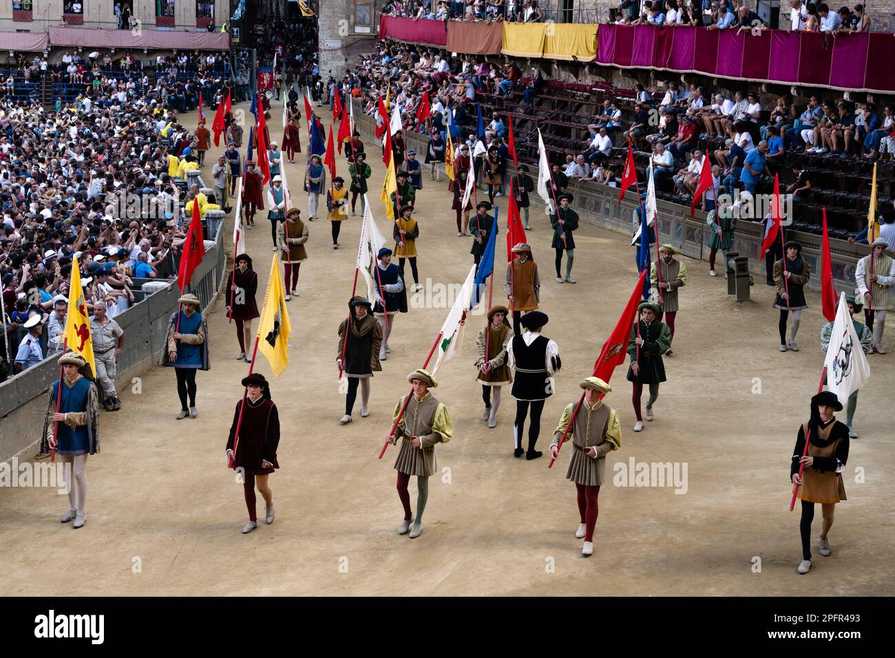 Siena, Italy - August 17 2022: Corteo Storico of the Palio di Siena, Men Bearing the Insignia of the City, called Potesteria, wearing Traditional Clot Stock Photo