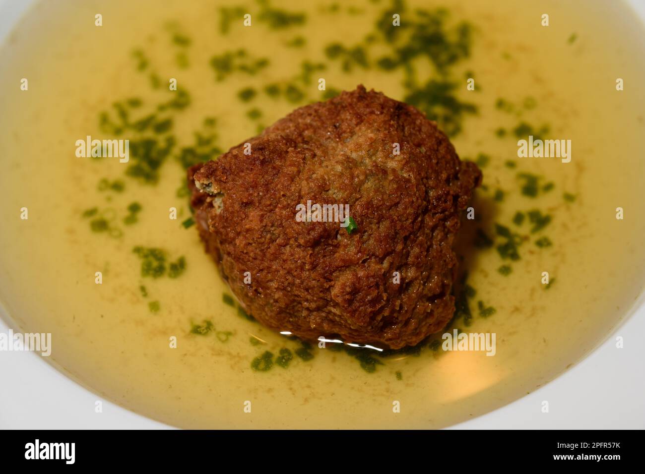 Liver Dumpling Soup or Leberknoedelsuppe, Austrian Beef Broth Stock Photo