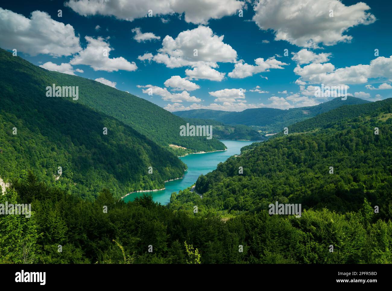 A beautiful lake in the forest. Blue sky and clouds. Clean water resources and the environment Stock Photo