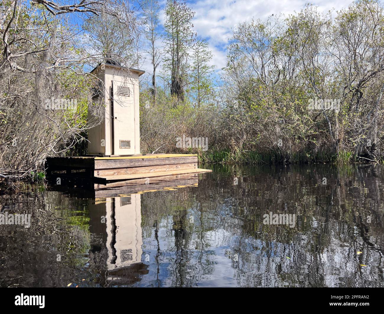 Restroom lavatory facilities seen from the water in Okefenokee National Wildlife Refuge, North America's largest blackwater swamp. Stock Photo