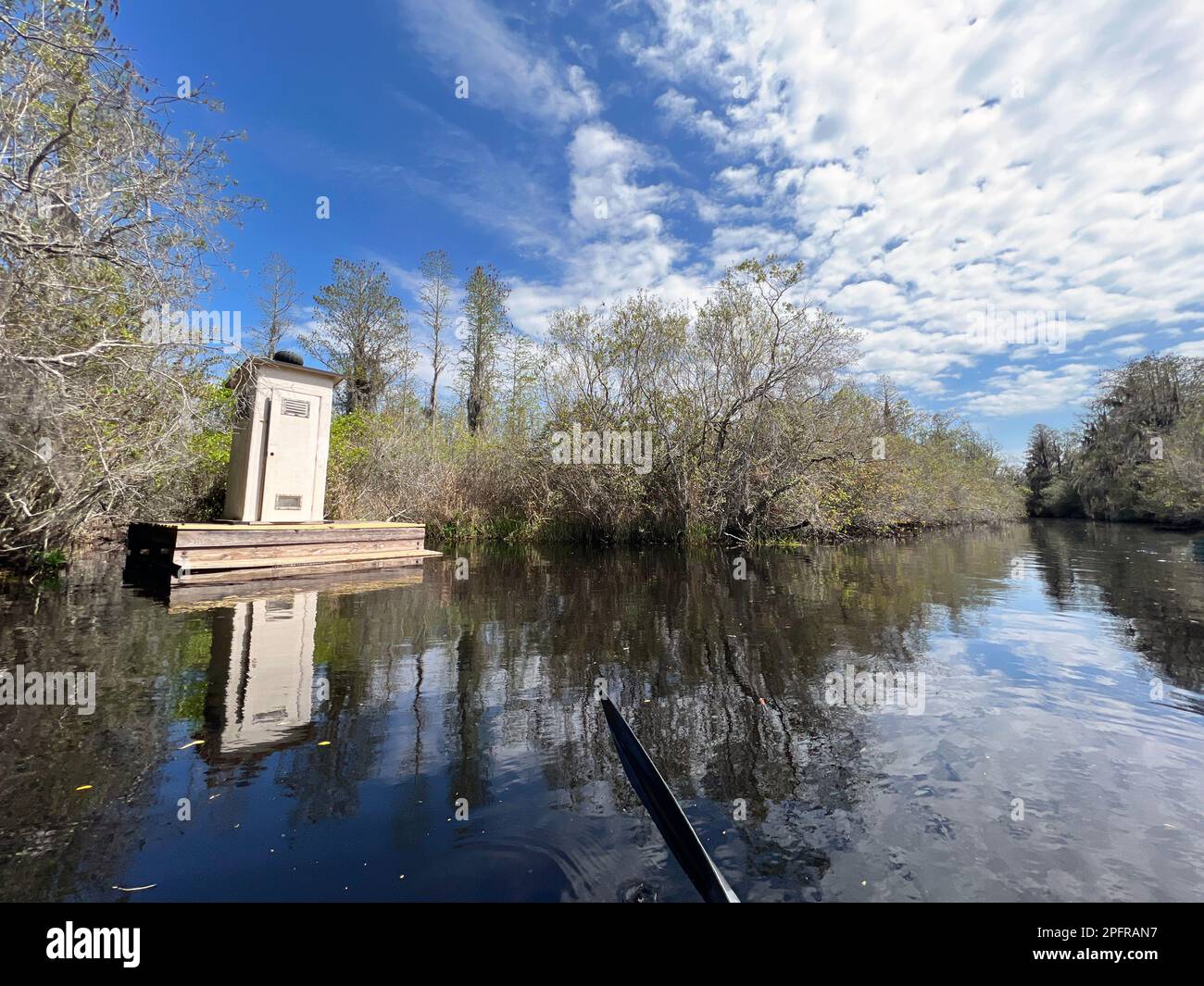 Restroom lavatory facilities seen from the water in Okefenokee National Wildlife Refuge, North America's largest blackwater swamp. Stock Photo