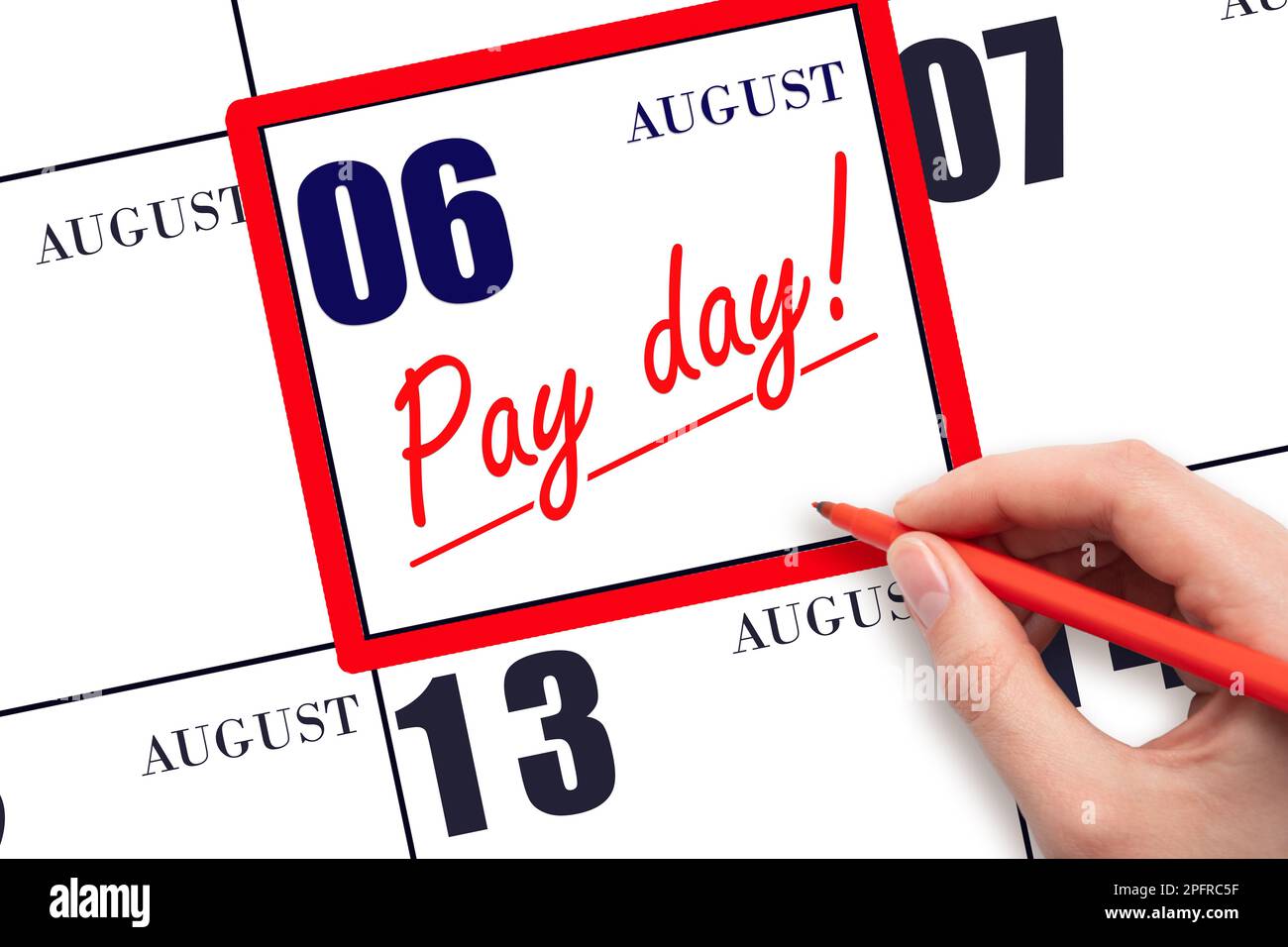6th day of August. Hand writing text PAY DATE on calendar date August 6 and underline it. Payment due date.  Reminder concept of payment. Summer month Stock Photo