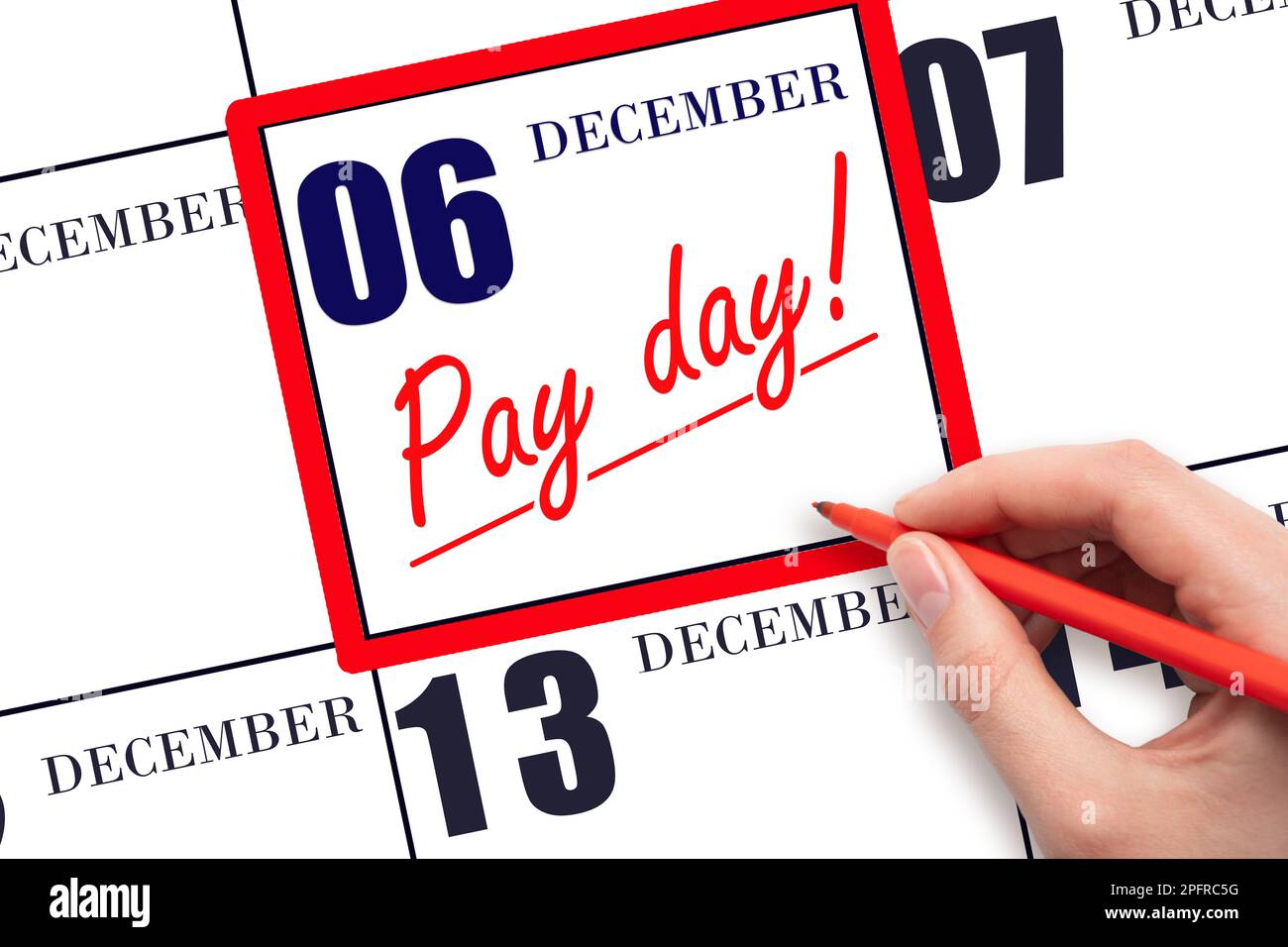 6th day of December. Hand writing text PAY DATE on calendar date December 6 and underline it. Payment due date.  Reminder concept of payment. Winter m Stock Photo