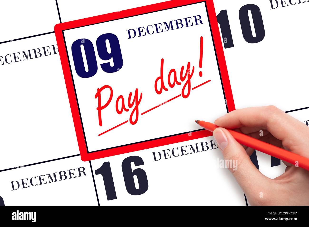 9th day of December. Hand writing text PAY DATE on calendar date December 9 and underline it. Payment due date.  Reminder concept of payment. Winter m Stock Photo