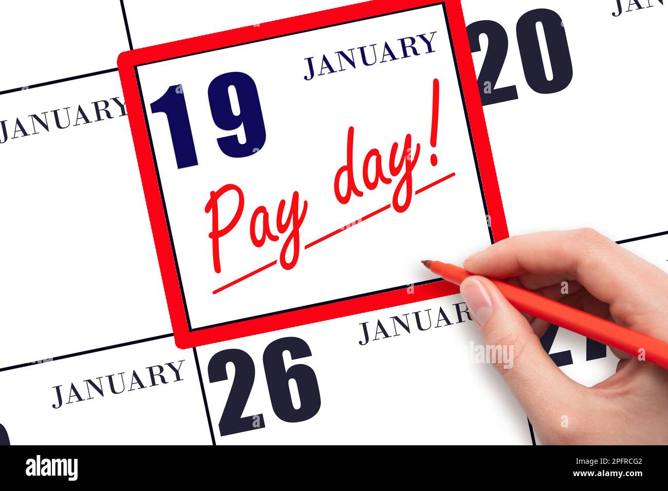 19th day of January. Hand writing text PAY DATE on calendar date January 19 and underline it. Payment due date.  Reminder concept of payment. Winter m Stock Photo