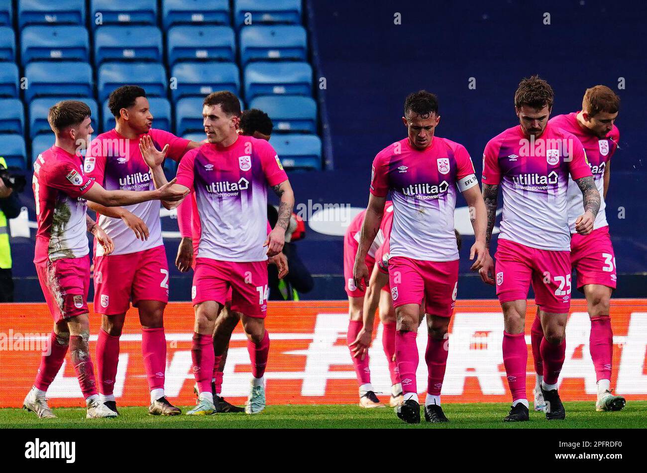 Huddersfield Town's Danny Ward (second right) is congratulated by his team mates after scoring the first goal of the game during the Sky Bet Championship match at The Den, London. Picture date: Saturday March 18, 2023. Stock Photo