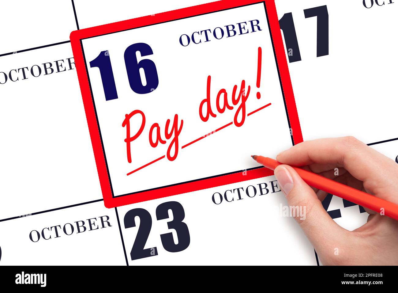 16th day of October. Hand writing text PAY DATE on calendar date October 16 and underline it. Payment due date.  Reminder concept of payment. Autumn m Stock Photo