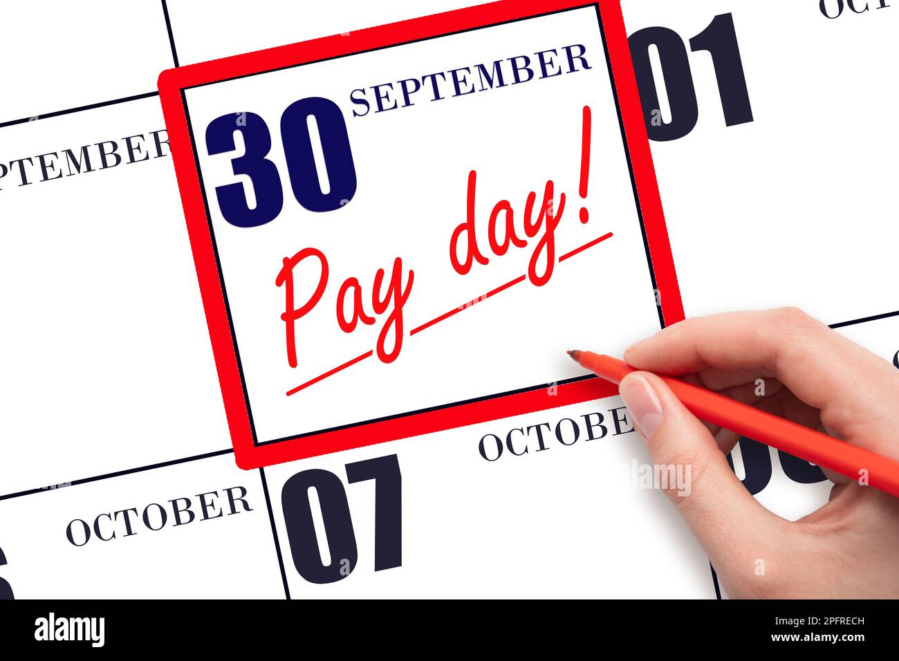 30th day of September. Hand writing text PAY DATE on calendar date September  30 and underline it. Payment due date.  Reminder concept of payment. Aut Stock Photo