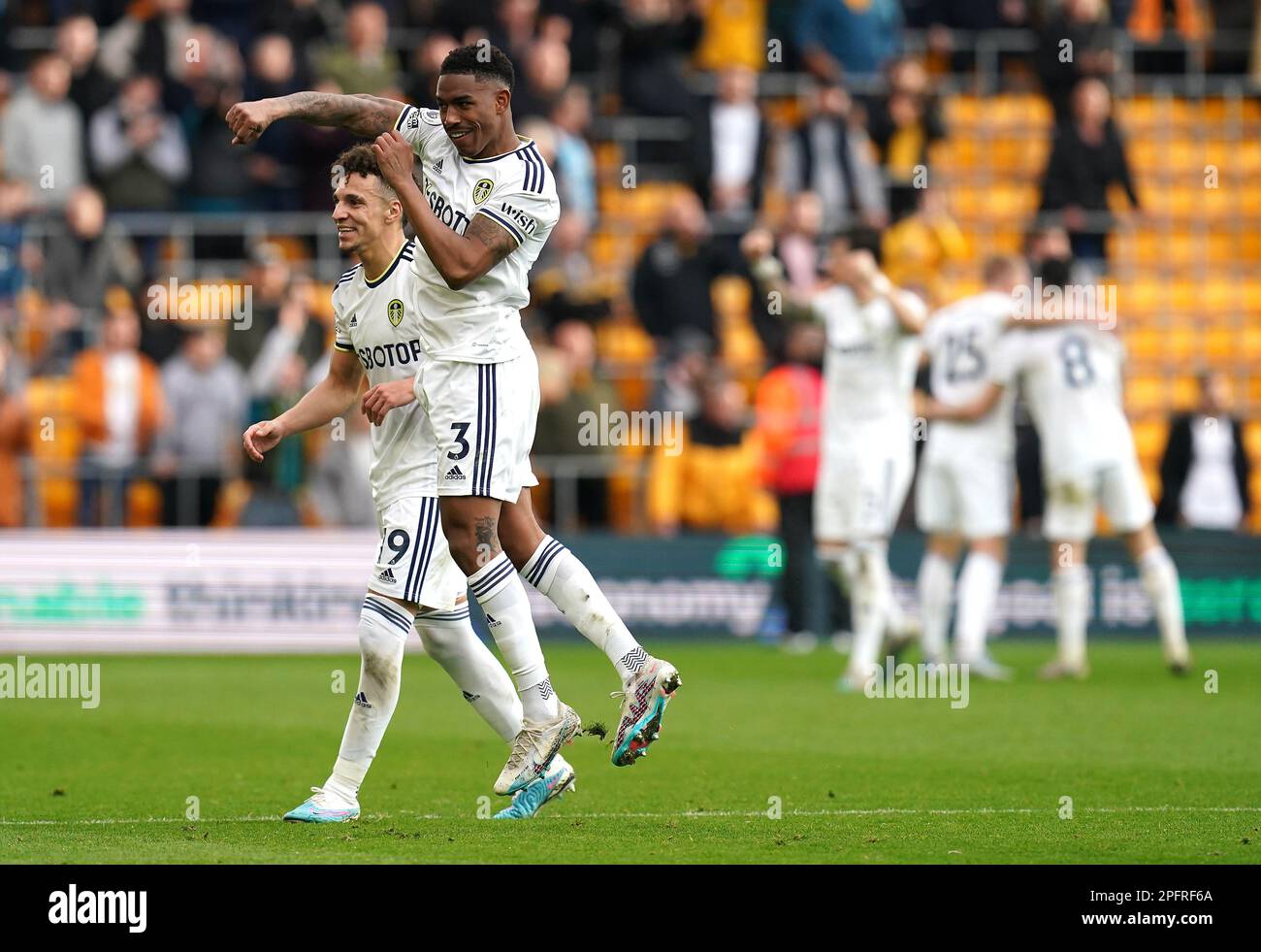 Leeds United's Rodrigo Moreno (left) and Junior Firpo celebrate after the final whistle in the Premier League match at Molineux Stadium, Wolverhampton. Picture date: Saturday March 18, 2023. Stock Photo