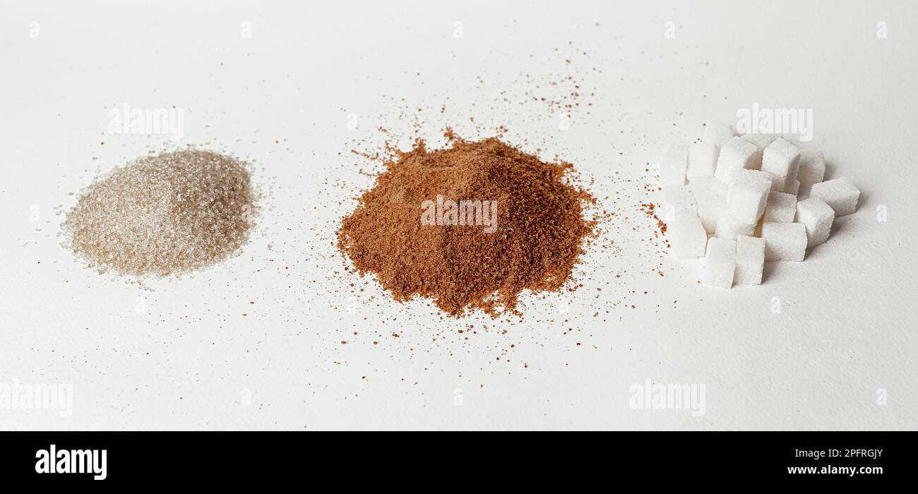 Three types of sugar, cane brown crystals, coconut granules and beet