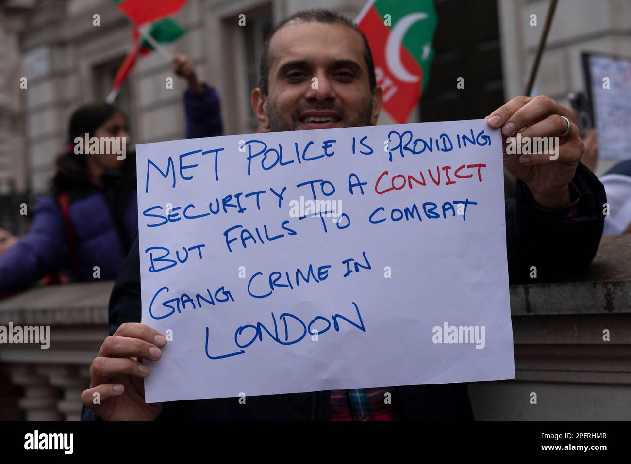 Whitehall, Westminster, London, UK. 18th Mar, 2023. A protest is taking place outside Downing Street in support of former Pakistan prime minister Imran Khan, and against Nawaz Sharif who is living in London. Placard stating; Met Police is providing security to a convict [Sharif] but fails to combat gang crime in London Stock Photo