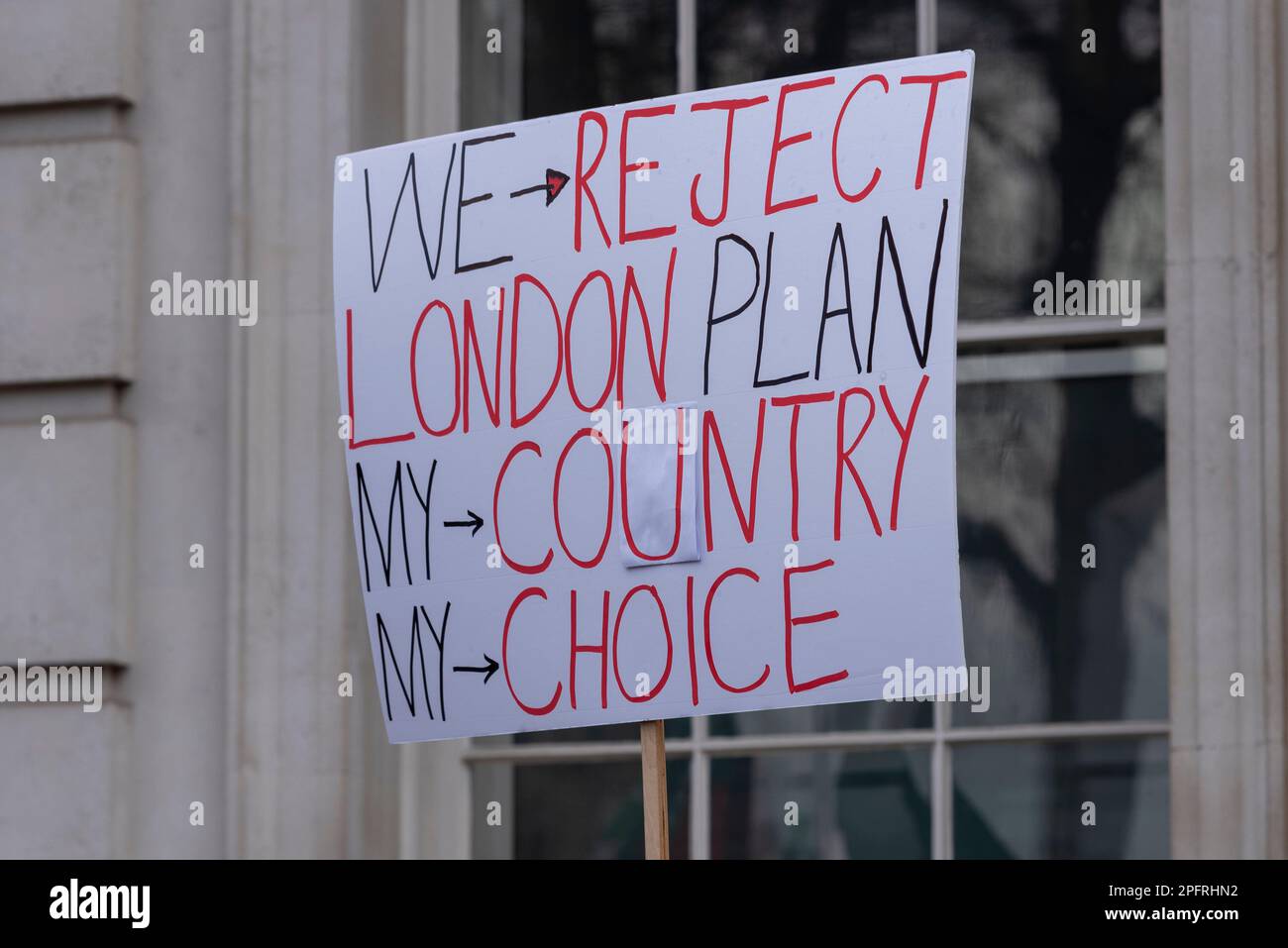 Whitehall, Westminster, London, UK. 18th Mar, 2023. A protest is taking place outside Downing Street in support of former Pakistan prime minister Imran Khan, and against Nawaz Sharif who is living in London. Placard, stating We reject London Plan, my country, my choice Stock Photo