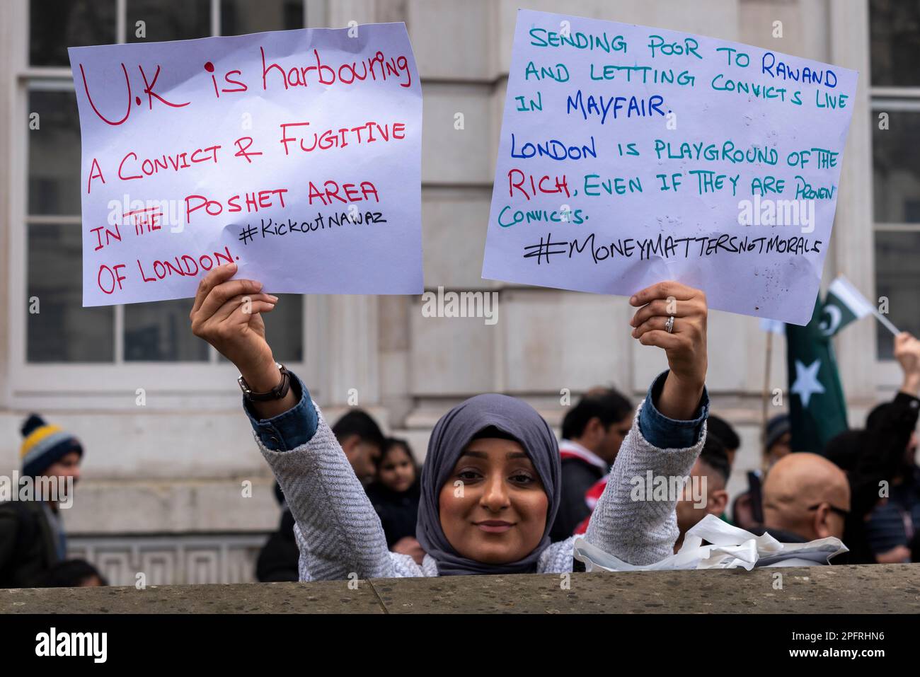 Whitehall, Westminster, London, UK. 18th Mar, 2023. A protest is taking place outside Downing Street in support of former Pakistan prime minister Imran Khan, and against Nawaz Sharif who is living in London. Female with placards Stock Photo