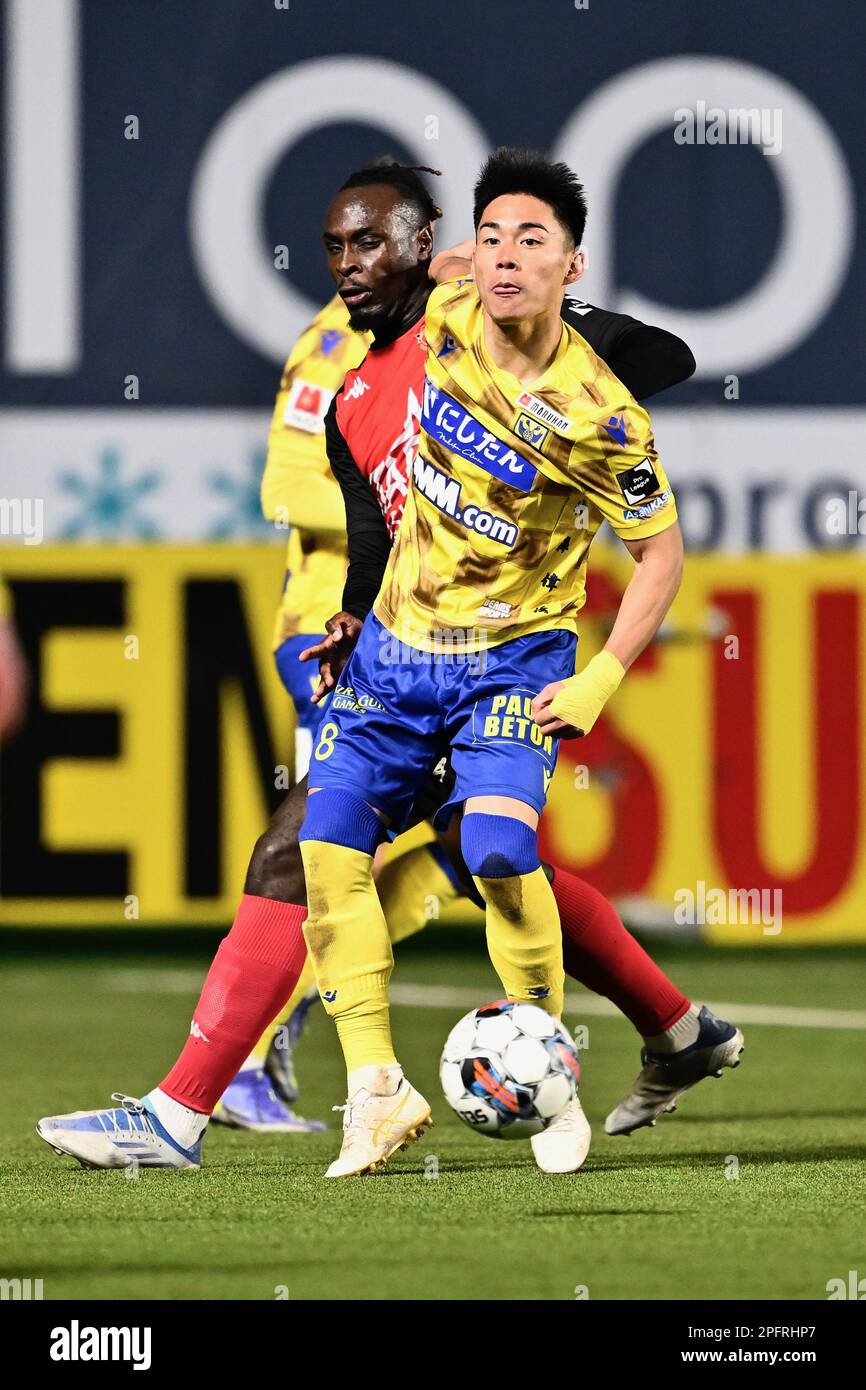 Seraing's Marvin Silver Tshibuabua and STVV's Daichi Hayashi fight for the ball during a soccer match between Sint-Truidense VV and RFC Seraing, Saturday 18 March 2023 in Sint-Truiden, on day 30 of the 2022-2023 'Jupiler Pro League' first division of the Belgian championship. BELGA PHOTO JOHAN EYCKENS Stock Photo