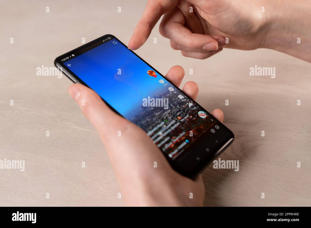 Lodz, Poland February 07 2023 Scrolling TikTok videos, feed on mobile ...