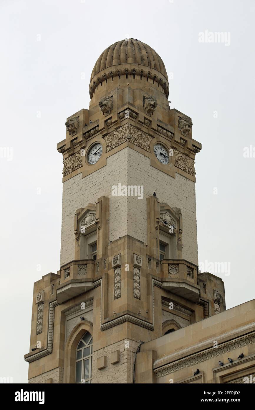 Clock tower of the old railway station building in Baku Stock Photo