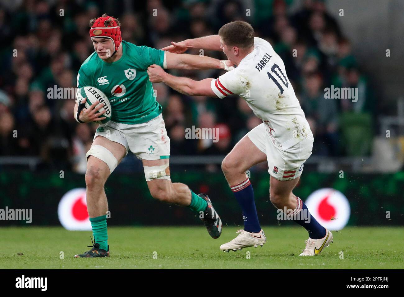 Irelands Josh van der Flier holds off Englands Owen Farrell during the Six Nations rugby union international match between Ireland and England at the Aviva Stadium, in Dublin, Saturday, March 18, 2023