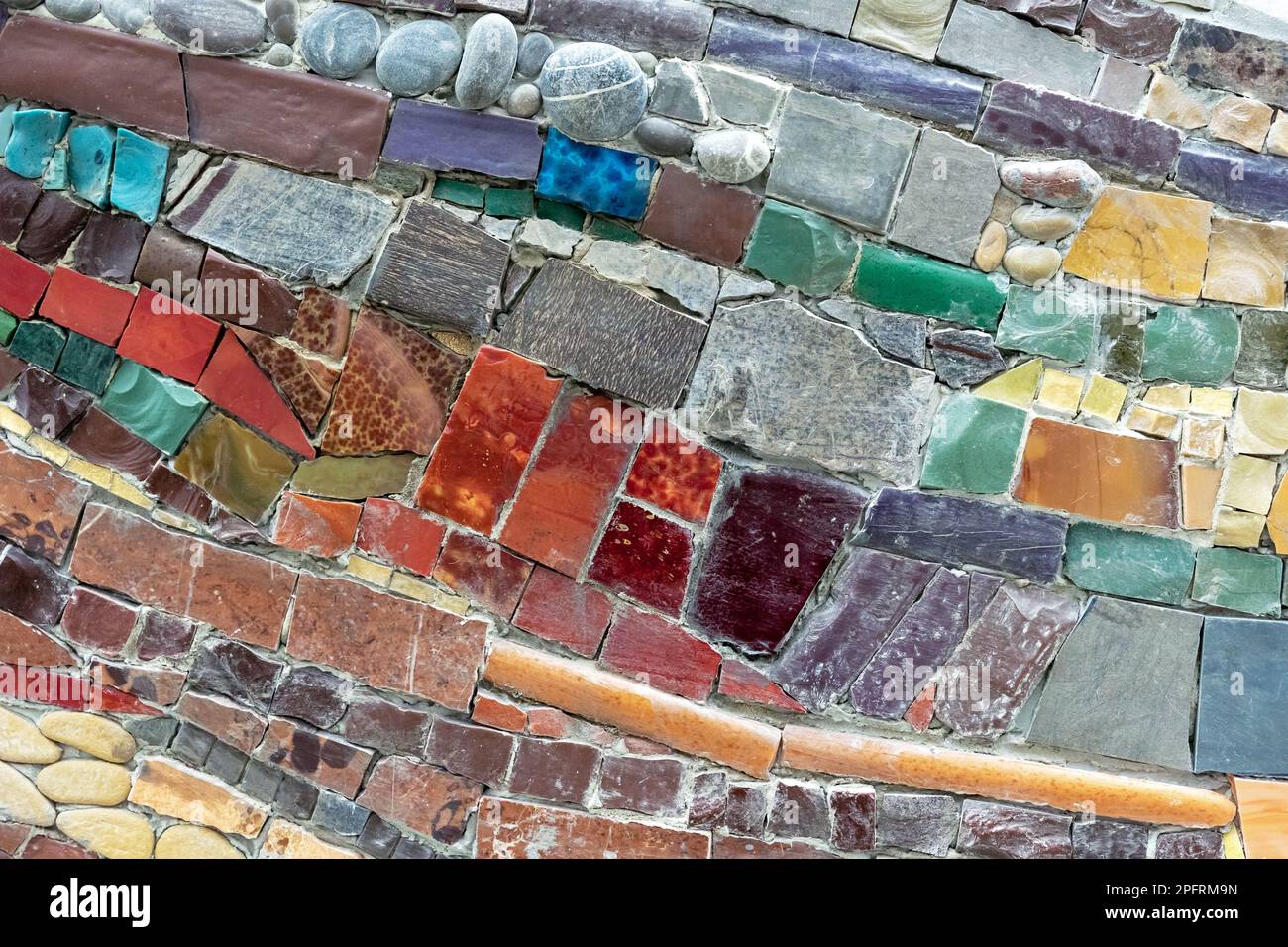 Colorful stone mosaic with chaotic pattern, seamless. Marble-stone mosaic texture. Stock Photo
